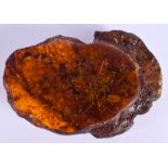 A CONTINENTAL CARVED AMBER NATURALISTIC BOULDER. 481 grams. 16 cm x 11 cm.