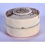 A 19TH CENTURY JAPANESE MEIJI PERIOD CARVED IVORY BOX AND COVER decorated with elephants. 6.5 cm dia