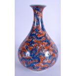 A 19TH CENTURY CHINESE BLUE AND WHITE PORCELAIN VASE Qing, painted with dragons amongst coral colour
