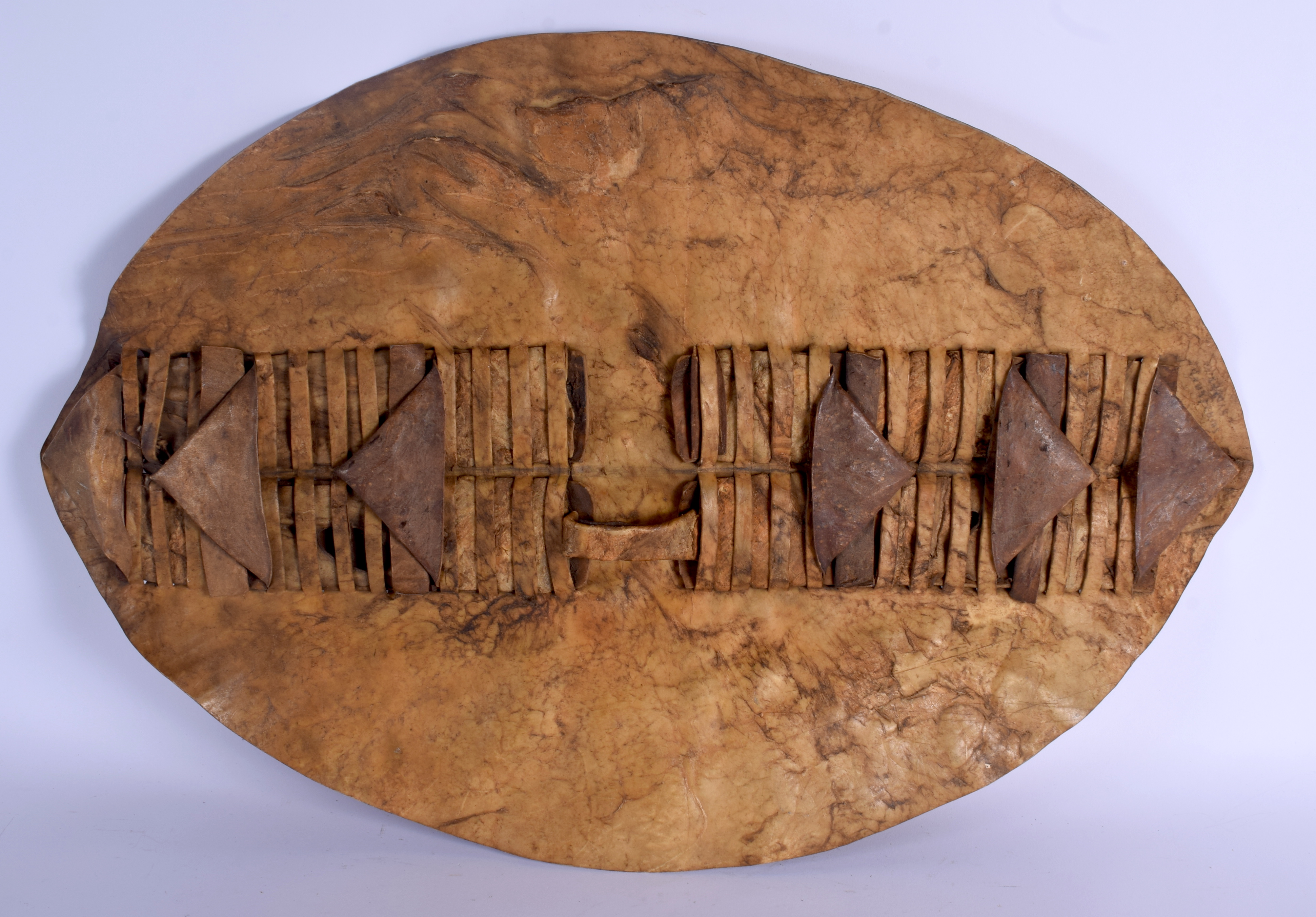 AN UNUSUAL TRIBAL HIDE SHIELD. 58 cm x 40 cm. - Image 2 of 4