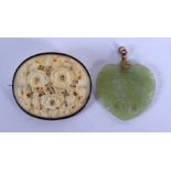 A 19TH CENTURY CHINESE CARVED IVORY BROOCH together with a jade pendant. (2)