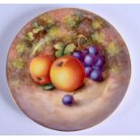 A ROYAL WORCESTER PLATE painted with fruit by John Freeman, signed Freeman code for 1959, black mark