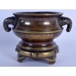 A RARE 19TH CENTURY CHINESE BRONZE CENSER ON STAND Qing, formed with bamboo type handles, of natural