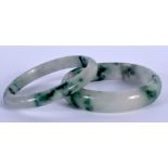 TWO CHINESE JADEITE BANGLES 20th Century. 8.5 cm diameter. (2)