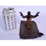 A 19TH CENTURY AUSTRIAN COLD PAINTED BRONZE FIGURE OF A MALE modelled upon a carpet. 18 cm wide.
