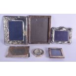 SIX SILVER PHOTOGRAPH FRAMES. Largest 26 cm x 19 cm. (6)