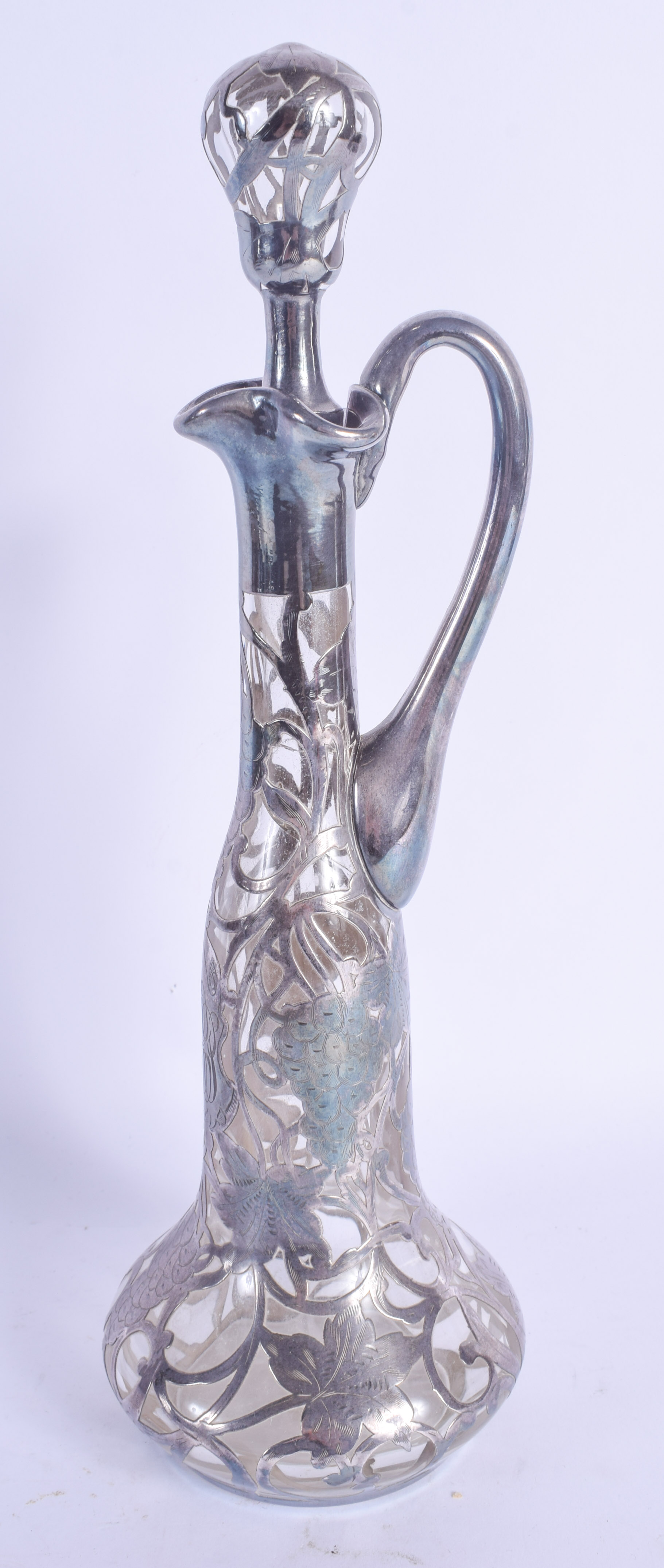 AN ART NOUVEAU SILVER OVERLAID GLASS DECANTER AND STOPPER. 28 cm high. - Image 2 of 2