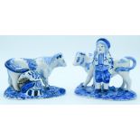 Two Delft pottery figures of Cows and farm hands 13 x 16 cm (2).