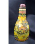 A Chinese glass snuff bottle decorated with mountains birds and foliage 9 cm .