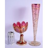 A 19TH CENTURY BOHEMIAN ENAMELLED RUBY GLASS COMPORT together with a gilt decorated vase. Largest 38