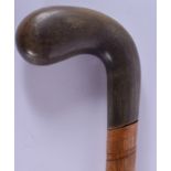 A RARE 19TH CENTURY CONTINENTAL DOUBLE ENDED RHINOCEROS HORN HANDLED WALKING CANE. 85 cm long.