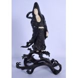 A 19TH CENTURY JAPANESE MEIJI PERIOD BRONZE AND IVORY FIGURE OF A FEMALE modelled upon crashing wave