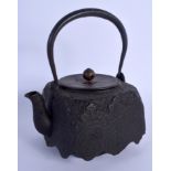 A 19TH CENTURY JAPANESE MEIJI PERIOD CAST IRON TETSUBIN TEAPOT with bronze lid. 22 cm x 14 cm inc ha