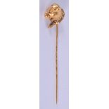 AN ANTIQUE GOLD DOG HEAD TIE PIN. 4 grams. 9 cm long.