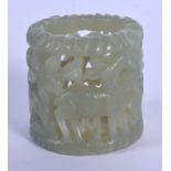 AN EARLY 20TH CENTURY CHINESE GREEN JADE ARCHERS RING Late Qing/Republic, decorated with deer. 2.5 c