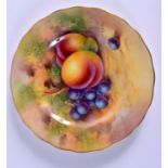 A ROYAL WORCESTER PLATE painted with fruit by H. Ayrton, signed, date for 1921. 16cm wide.