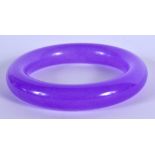 A CHINESE CARVED PURPLE JADE BANGLE 20th Century. 8 cm diameter.