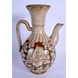 A LARGE 19TH CENTURY CHINESE POTTERY EWER carved with foliage and vines. 25 cm high.