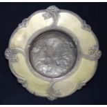 A Art deco style bronze dish with an embossed female and flowers to its centre 29cm.