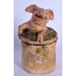 AN ANTIQUE AUSTRIAN TOBACCO JAR AND COVER in the form of a pig in money. 22 cm high.