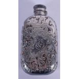 AN ART NOUVEAU SILVER OVERLAID HIP FLASK overlaid with foliage. 15 cm x 7 cm.