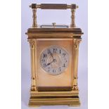 A 19TH CENTURY FRENCH REPEATING CARRIAGE CLOCK of square form, with column supports. 19 cm high inc