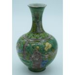 A Chinese green glaze vase decorated with kite flyers 19cm.