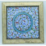 A framed Islamic tile 24 x 24 cm.