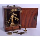 AN ANTIQUE BRASS MICROSCOPE. Box 28 cm x 14 cm.