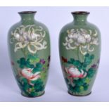 A PAIR OF EARLY 20TH CENTURY JAPANESE MEIJI PERIOD CLOISONNE ENAMEL VASES decorated with flowers. 13
