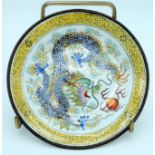 A small Chinese enamelled plate decorated with a dragon 13.5cm.