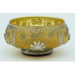 A small Middle Eastern glass bowl with white metal decorations 13 x 6 cm.
