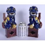 A PAIR OF 19TH CENTURY CHINESE BLUE GLAZED BUDDHISTIC DOGS OF FOE Qing, modelled upon a brown glazed