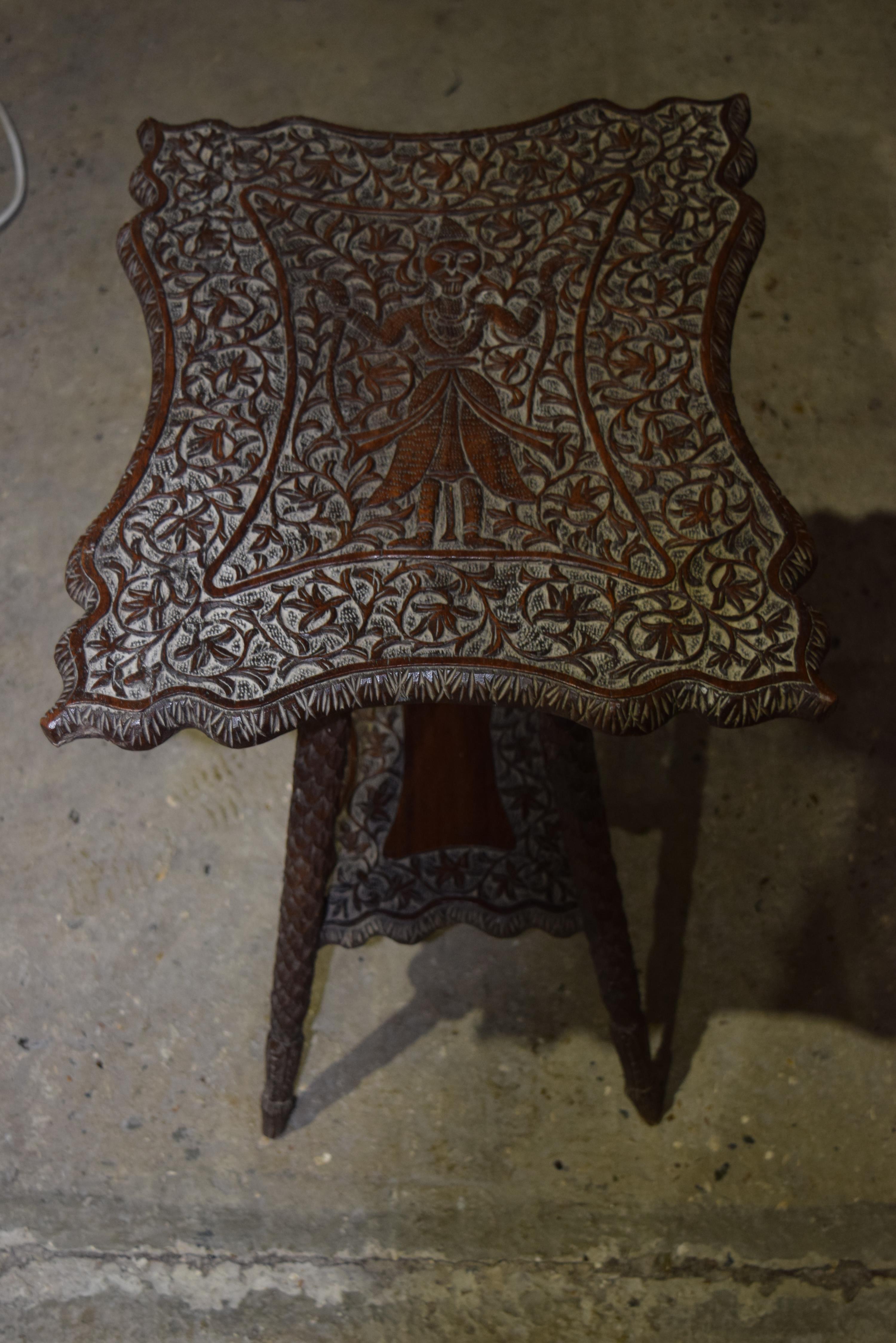 A small Anglo Indian carved wooden table 60 x 48 cm.