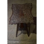 A small Anglo Indian carved wooden table 60 x 48 cm.