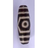 A CHINESE GOLD INLAID TIBETAN BEAD. 4 cm long.