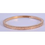 A VICTORIAN GOLD PLATED BANGLE. 8 cm diameter.