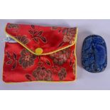 A CHINESE LAPIS PLAQUE within a purse. 5.5 cm x 3.5 cm.