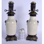 A PAIR OF 19TH CENTURY CHINESE GE TYPE CRACKLE GLAZED VASES converted to oil lamps. Porcelain 21 cm