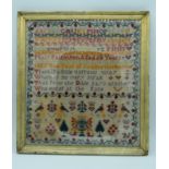 A Framed Victorian sampler dated 1887 48 x 43 cm.