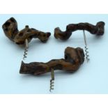 Three corkscrews with root wood handles. (3)
