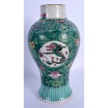 A LATE 18TH/19TH CENTURY CHINESE TURQUOISE GLAZED VASE painted with dragons and foliage. 25 cm high.