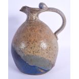 AN UNUSUAL STONEWARE STUDIO POTTERY JUG. 24.5 cm high.