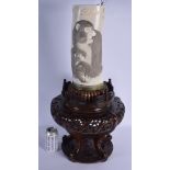 A LARGE 19TH CENTURY JAPANESE MEIJI PERIOD CARVED IVORY TUSK VASE carved with apes holding floral sp