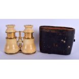 A PAIR OF ANTIQUE IVORY OPERA GLASSES. 10 cm x 10 cm.