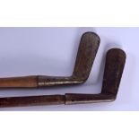 TWO VINTAGE GOLF CLUBS. 85 cm long. (2)