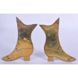 A PAIR OF ANTIQUE FOLK ART BRASS SHOES. 11 cm x 5 cm.