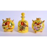 Royal Worcester spherical pair of vases on three ball feet each painted with two chubby birds on a