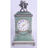 AN UNUSUAL CONTINENTAL SILVER AND ENAMEL CHERUB CLOCK overlaid with neo classical swags. 448 grams.