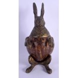 A RARE 19TH CENTURY BRONZE AND COCONUT FORM INKWELL in the form of a standing hare. 20.5 cm high.